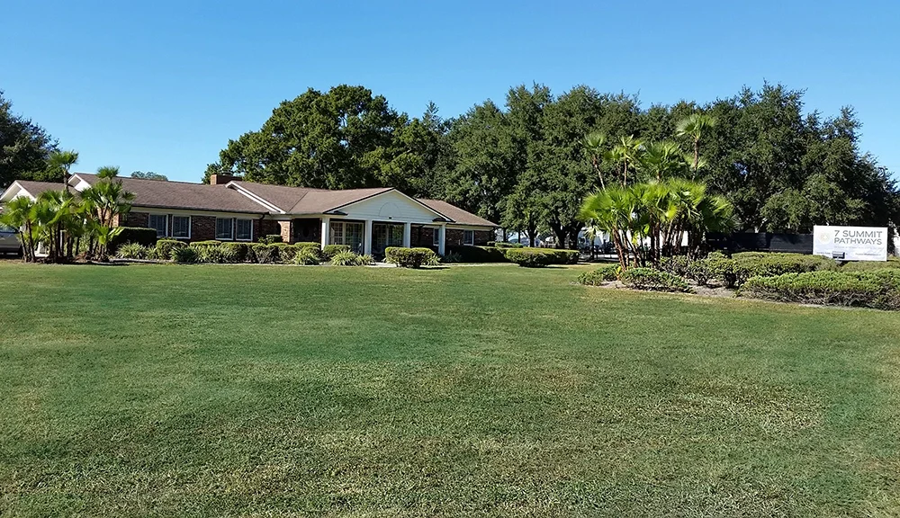 7 Summit Pathways building with lawn and trees