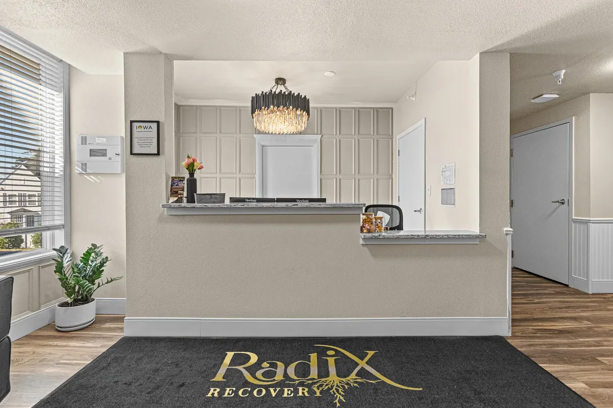 Radix Recovery reception desk and branded entrance mat